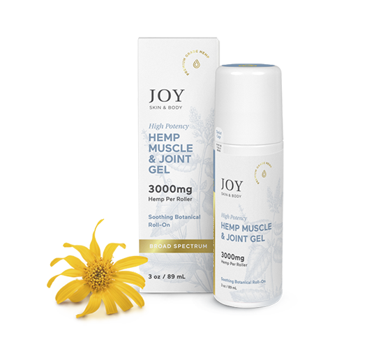White roll-on bottle and box of Joy Hemp Muscle & Joint Gel 3000mg next to a yellow flower.